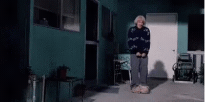 Elderly Woman Standing With Shovel GIF