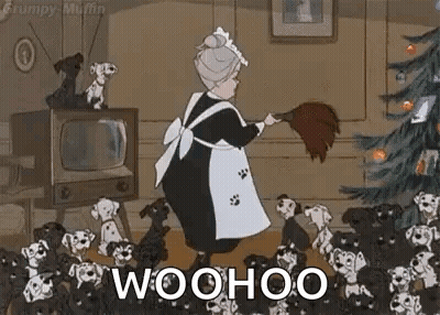Elderly Woman Sweeping Floor By Christmas Tree With Dalmatian Puppies GIF
