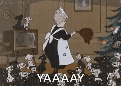 Elderly Woman Sweeping Floor In Front Of Christmas Tree GIF