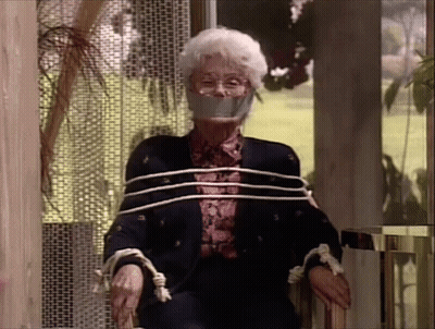 Elderly Woman Tied Up With Ropes And Tape In Chair GIF