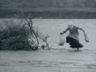 Elderly Woman Walking On Frozen Lake GIF