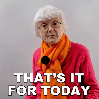 Elderly Woman Wearing Glasses And Orange Scarf GIF