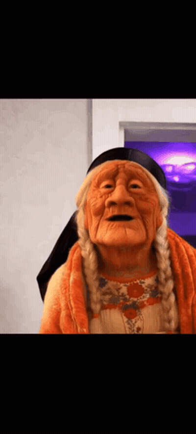 Elderly Woman Wearing Native American Mask GIF