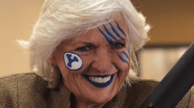 Elderly Woman With Blue Paint And Y On Forehead GIF