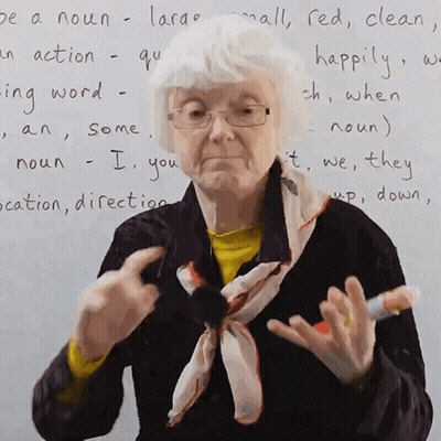 Elderly Woman With White Board Saying Be A Noun Large GIF