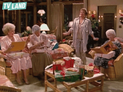Elderly Women Sitting In Living Room With TV Land Logo GIF