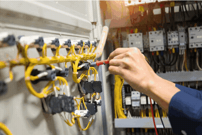 Electrician Working On Circuit Board With Multimeter GIF