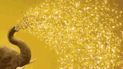 Elephant Blowing Gold Confetti From Trunk GIF