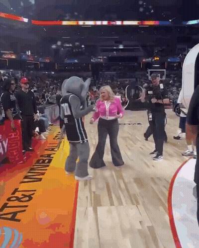 Elephant Mascot Dancing With Woman On Basketball Court GIF