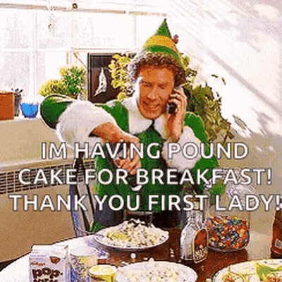 Elf Man Talking On Cell Phone At Table GIF