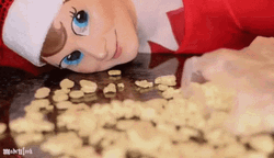 Elf On The Shelf Moving Licking Cereals GIF