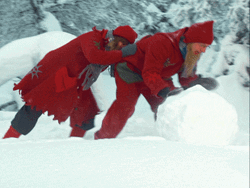 Elf Santa Rolling A Snow GIF