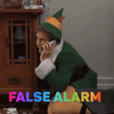 Elf Talking on Cell Phone Saying False Alarm