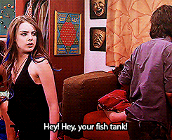 Elizabeth Gillies Pointing His Fish Tank GIF