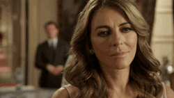 Elizabeth Hurley Drinking GIF | GIFDB.com