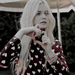 Elle Fanning Heartbreak Hand Sign Laugh GIF | GIFDB.com