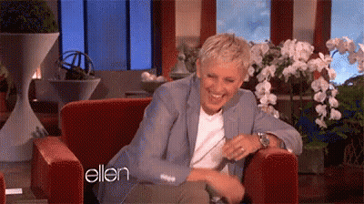 Ellen Degeneres Is Laughing While Sitting In A Chair On A Television Show . GIF