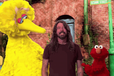 Elmo And Big Bird Are Standing Next To A Man In Front Of Sesame Street GIF