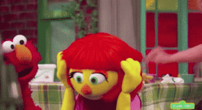 Elmo And Elmo Sitting At Table GIF