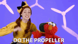 Elmo Dancing And Emma Watkins Do The Propeller GIF