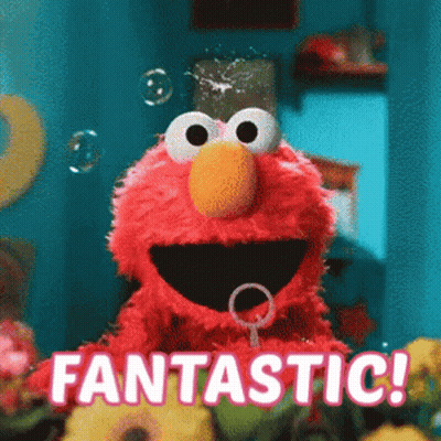 Elmo From Sesame Street Is Blowing Soap Bubbles And Saying Fantastic . GIF