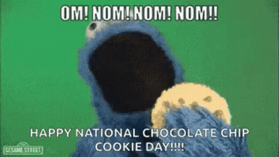 Elmo From Sesame Street Is Eating A Chocolate Chip Cookie . GIF