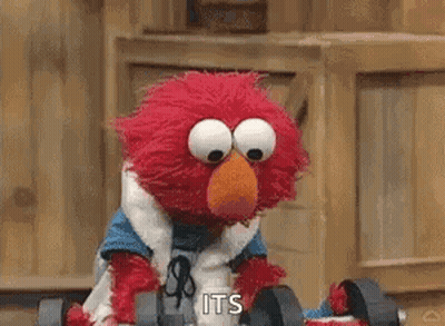 Elmo From Sesame Street Is Holding A Pair Of Dumbbells In His Hands . GIF