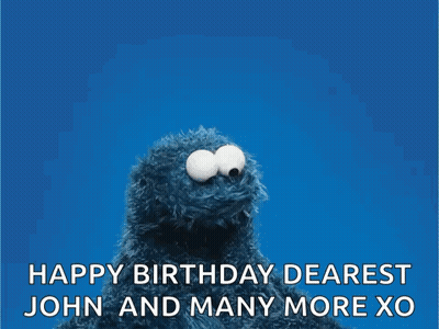 Elmo From Sesame Street Is Holding A Red Heart And Wishing John And Many More Xo . GIF