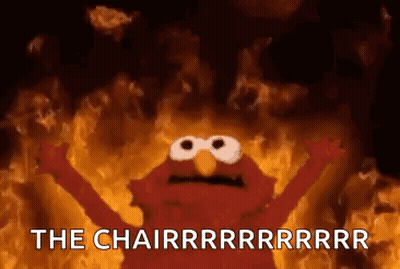 Elmo From Sesame Street Is On Fire With His Arms Outstretched And The Words `` The Chairrrrrrrr '' . GIF