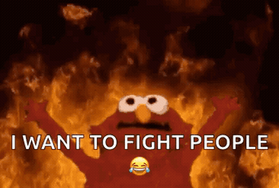 Elmo From Sesame Street Is On Fire With The Words `` I Want To Fight People '' . GIF