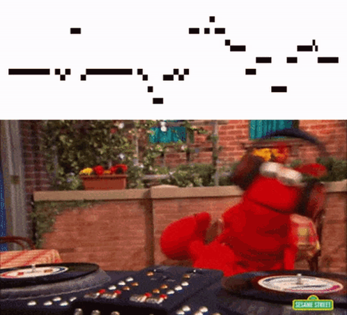 Elmo From Sesame Street Is Playing A Game Of Roulette On A Table GIF