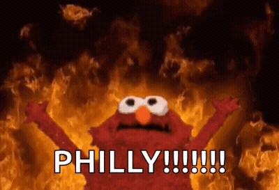 Elmo From Sesame Street Is Screaming In Front Of A Fire And The Words Philly !!! GIF