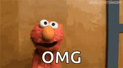 Elmo From Sesame Street Is Standing In Front Of A Door And Says Omg . GIF
