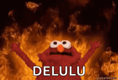 Elmo From Sesame Street Is Standing In Front Of A Fire And Says `` Delulu '' . GIF