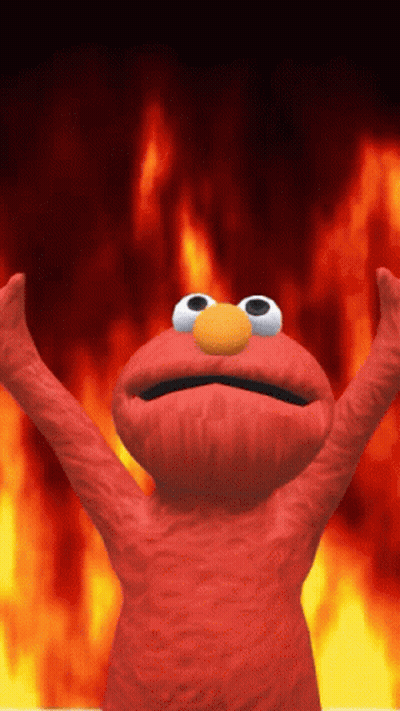 Elmo From Sesame Street Is Standing In Front Of A Fire Background GIF