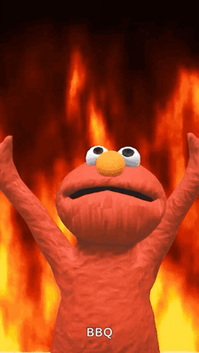 Elmo From Sesame Street Is Standing In Front Of A Fire With His Arms In The Air GIF