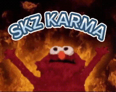 Elmo From Sesame Street Is Standing In Front Of A Fire With The Words " Skz Karma " Written Above Him GIF