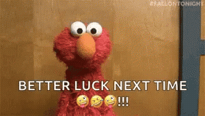 Elmo From Sesame Street Is Standing In Front Of A Wall And Says `` Better Luck Next Time '' . GIF