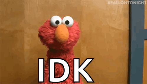Elmo From Sesame Street Is Standing In Front Of A Wooden Wall And Says `` Idk '' . GIF