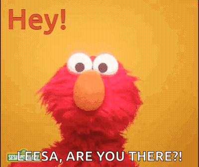 Elmo From Sesame Street Is Standing In Front Of A Yellow Background . GIF