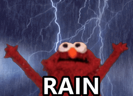 Elmo From Sesame Street Is Standing In The Rain GIF