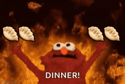 Elmo Holding Dumplings In Front Of Fire Saying Dinner GIF