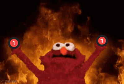 Elmo Is Holding Up Two Red Circles With The Number 1 On Them In Front Of A Fire GIF