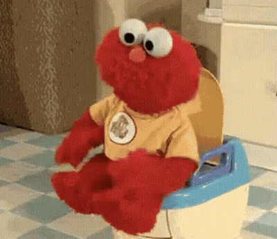 Elmo Is Sitting On A Potty Wearing A Shirt That Says Elmo GIF