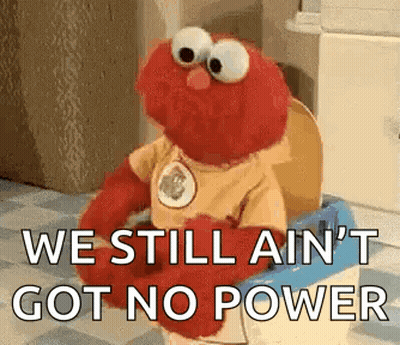 Elmo Is Sitting On A Toilet With The Words `` We Still Ain 'T Got No Power '' . GIF