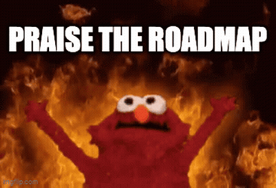 Elmo Is Standing In Front Of A Fire With The Words Praise The Roadmap Written Below Him GIF