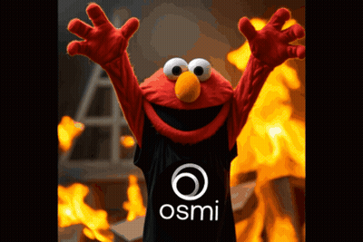 Elmo Is Wearing A Black Shirt With The Osmi Logo On It GIF