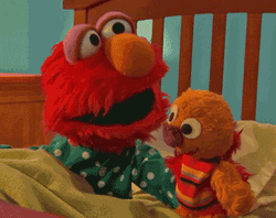 Elmo Kissing His Toy