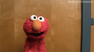 Elmo Sitting And Smiling GIF