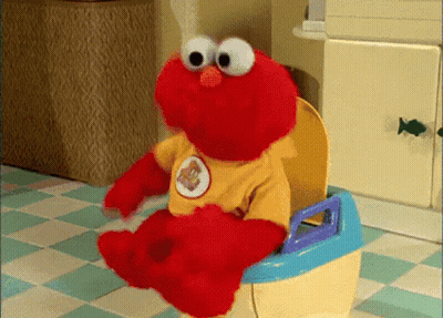 Elmo Sitting On Potty Wearing Yellow Bear Shirt GIF